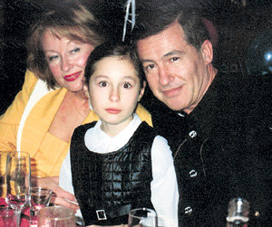 Лариса Удовиченко  с мужем и дочкой